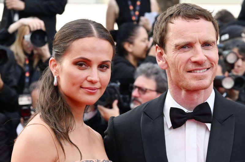 Michael Fassbender (R) and Alicia Vikander attend the Cannes Film Festival premiere of "Firebrand" in May. File Photo by Rune Hellestad/UPI