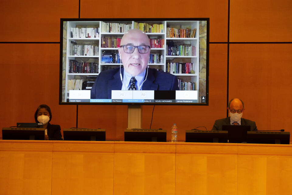 Thomas Andrews, UN Special Rapporteur on the human rights situation in Myanmar is displayed on a screen as he addresses his statement during the Human Rights Council special session on "the human rights implications of the crisis in Myanmar" at the European headquarters of the United Nations in Geneva, Switzerland, Friday, Feb. 12, 2021. The special session of the Human Rights Council on the situation in Myanmar is take in person and in virtualle due to the coronavirus pandemic. (Salvatore Di Nolfi/Keystone via AP)