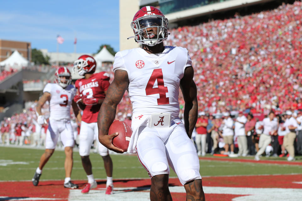 Oct 1, 2022; Fayetteville, Arkansas, USA; Alabama Crimson Tide quarterback Jalen Milroe (4) rushes for a touchdown in the second quarter against the Arkansas Razorbacks at Donald W. Reynolds Razorback Stadium. Mandatory Credit: Nelson Chenault-USA TODAY Sports