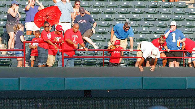 Fan Falls Into Bullpen Apparently Trying to Retrieve Ball, Comes to Feet  Before Leaving on Stretcher 