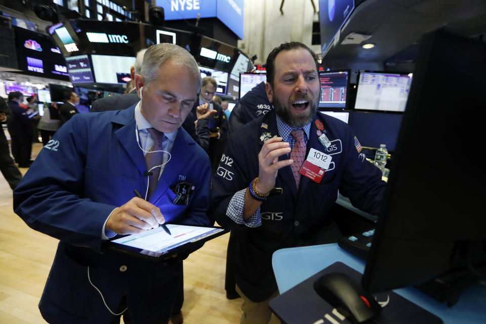 Trader Timothy Nick, left, and specialist Michael Pistillo work on the floor of the New York Stock Exchange, Monday, March 9, 2020. The Dow Jones Industrial Average plummeted 1,500 points, or 6%, following similar drops in Europe after a fight among major crude-producing countries jolted investors already on edge about the widening fallout from the outbreak of the new coronavirus. (AP Photo/Richard Drew)