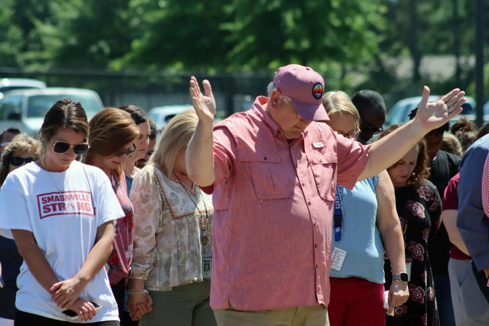 Community members prayed for Asher Sullivan during a vigil on Thursday.