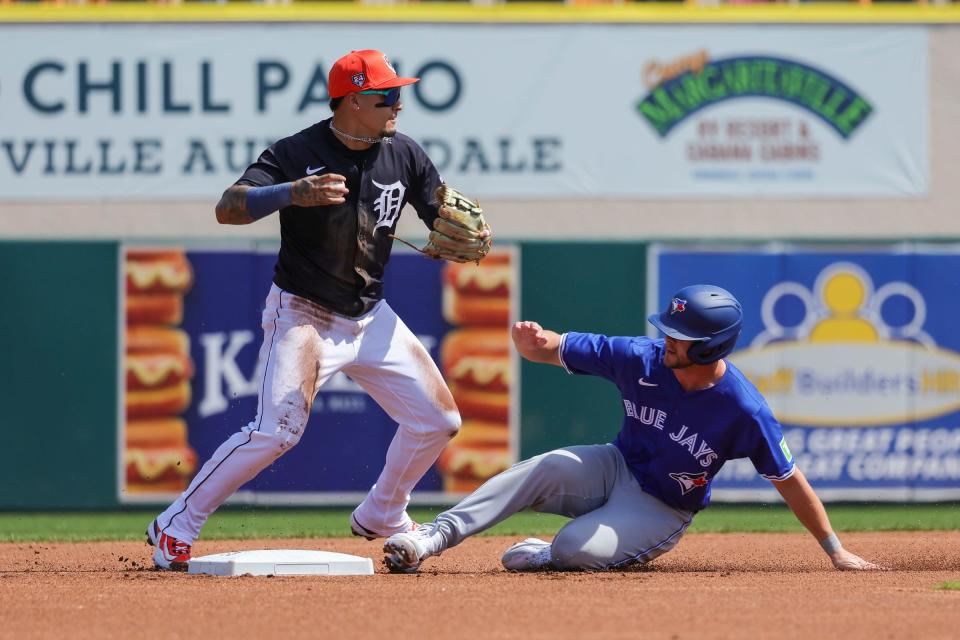 Toronto Blue Jays second baseman Ernie Clement is out at second as Detroit Tigers shortstop Javier Baez throws to first base at Publix Field at Joker Marchant Stadium on Thursday, Feb. 27, 2024 in Lakeland, Florida.