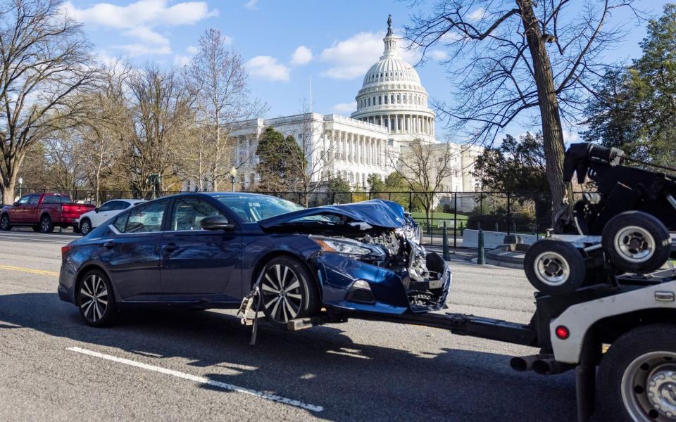 The car allegedly driven by Green was towed from the scene - EPA