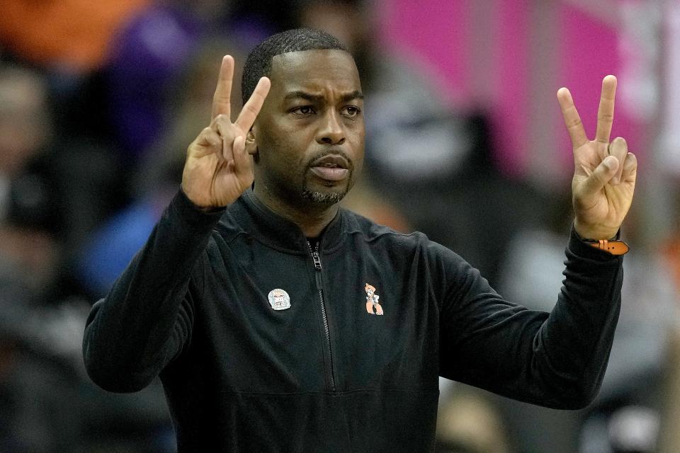 Oklahoma State head coach Mike Boynton motions to his players during the first half of an NCAA college basketball game against Texas in the second round of the Big 12 Conference tournament Thursday, March 9, 2023, in Kansas City, Mo. (AP Photo/Charlie Riedel)