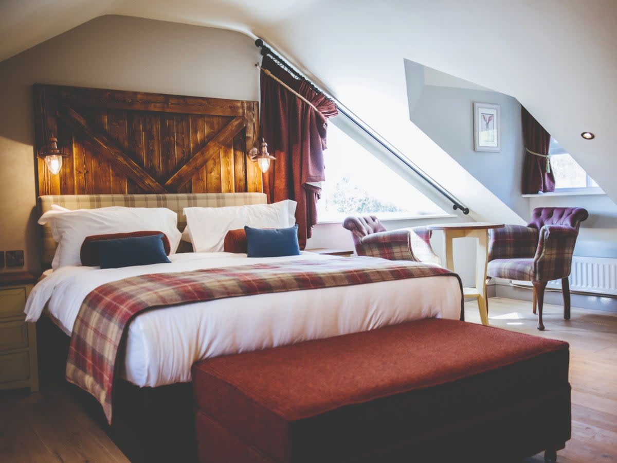 The Crown Inn’s traditionally furnished bedrooms overlook Pooley Bridge’s market place (Thee Crown Inn)