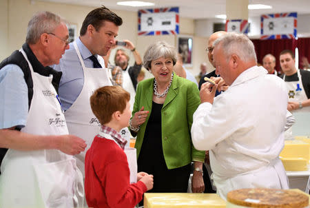 Britain's Prime Minister Theresa May samples cheese at the Royal Bath and West Show in Shepton Mallet, May 31, 2017. REUTERS/Leon Neal/Pool