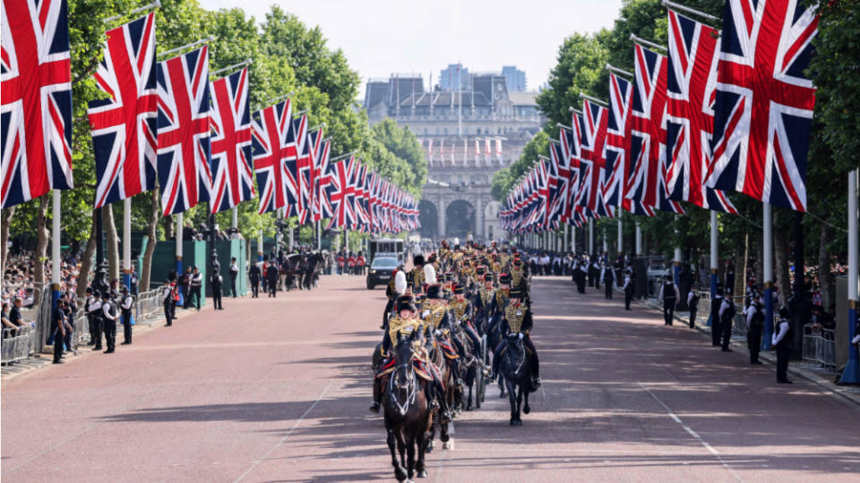 A lavish parade featured senior royals on horseback, more than 1,400 soldiers, 200 horses and 400 musicians. - Credit: AP