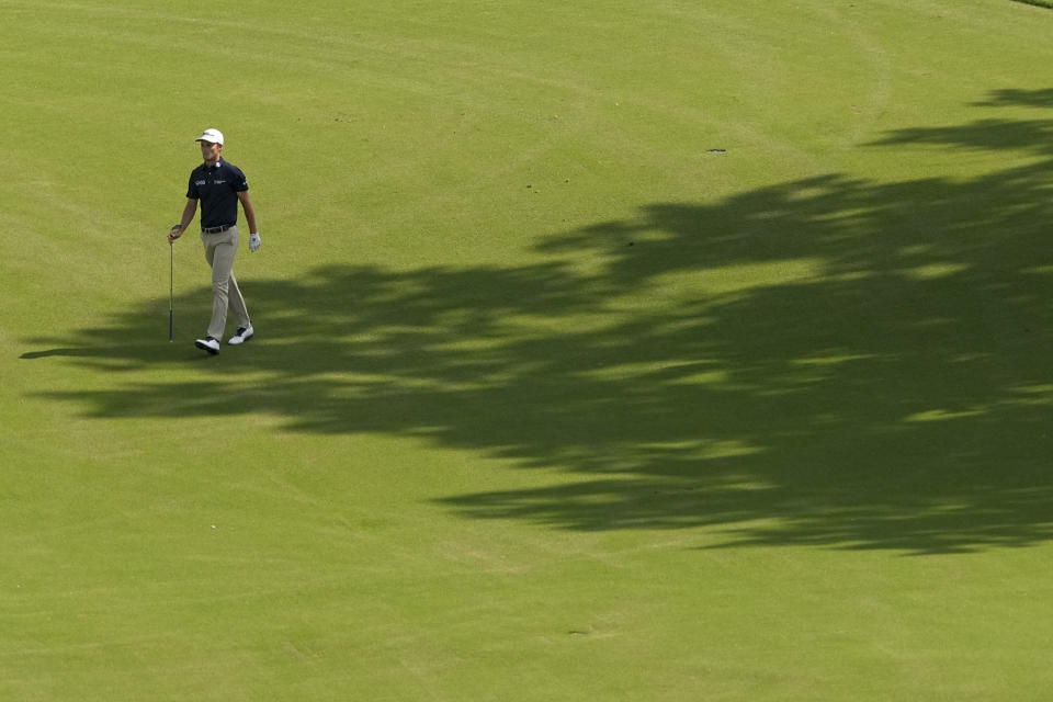 Will Zalatoris walks on the 18th hole during the first round of the PGA Championship golf tournament, Thursday, May 19, 2022, in Tulsa, Okla. (AP Photo/Matt York)