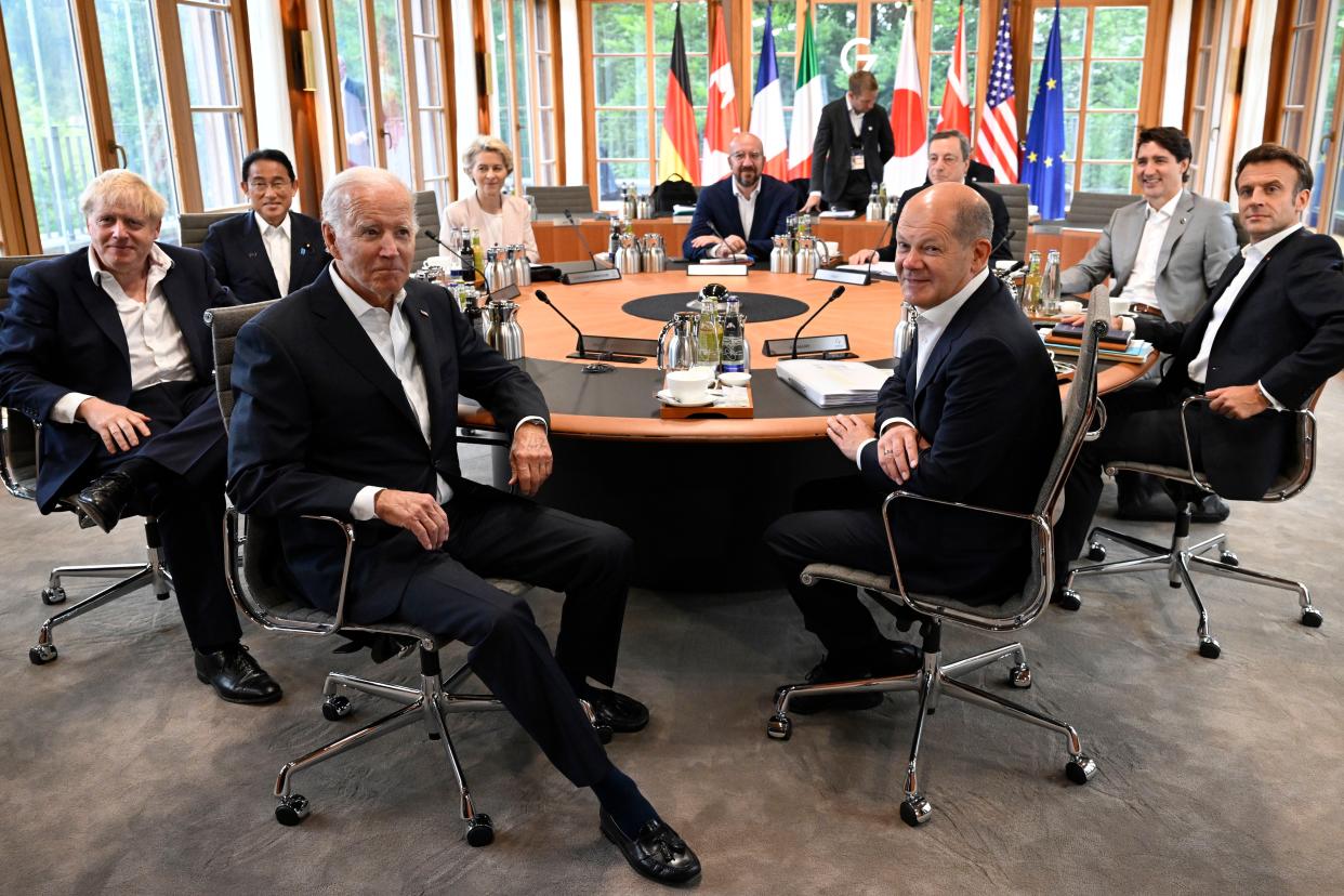 Clockwise from left, British Prime Minister Boris Johnson,  Japanese Prime Minister Fumio Kishida, the President of the European Commission Ursula von der Leyen, European Council President Charles Michel, Italian Prime Minister Mario Draghi, Canadian Prime Minister Justin Trudeau, French President Emmanuel Macron, German Chancellor Olaf Scholz and President Joe Biden attend a G7 work session on Tuesday.