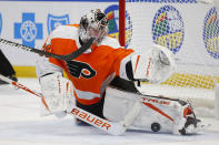 Philadelphia Flyers goalie Carter Hart (79) makes a pad save during the second period of an NHL hockey game against the Buffalo Sabres, Sunday, Feb. 28, 2021, in Buffalo, N.Y. (AP Photo/Jeffrey T. Barnes)