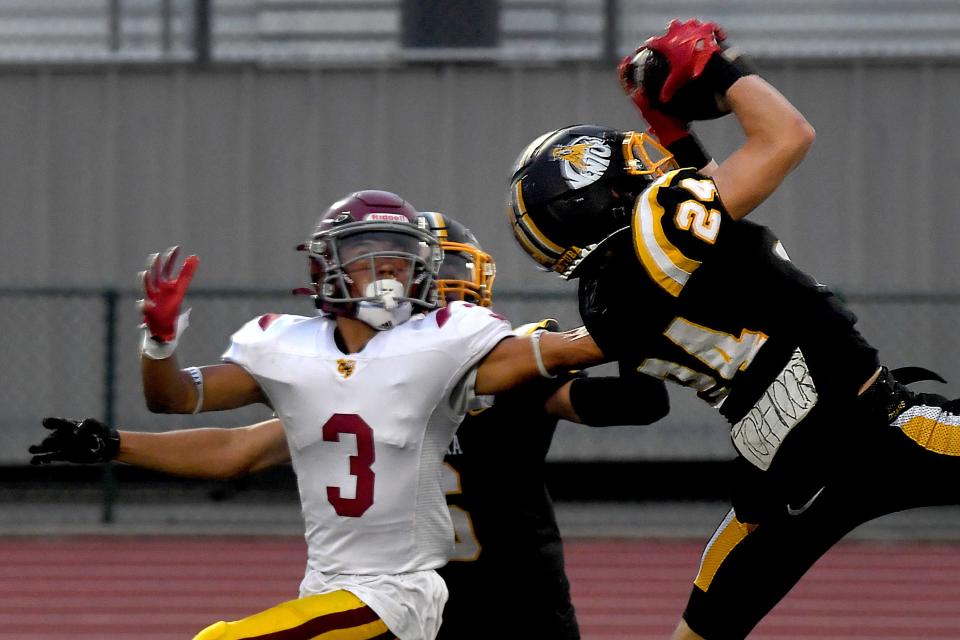 Ventura's Zayne McCulley intercepts a pass intended for Oxnard's Victor Menendez during the Cougars' 35-0 win in a nonleague game at Ventura High on Friday, Sept. 1, 2023. The game marked the 100th anniversary of the programs' first meeting and the 99th game overall.