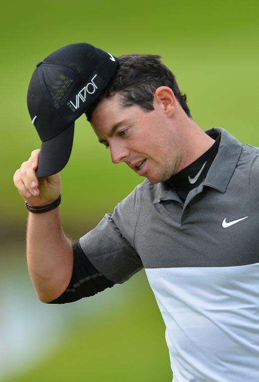 Northern Irish golfer Rory McIlroy gestures on the eighteenth hole on the second day of the PGA Championship at Wentworth Golf Club in Surrey, south west of London, on May 22, 2015