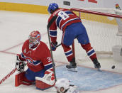 Montreal Canadiens goaltender Carey Price (31) and teammate Ben Chiarot react after the second Tampa Bay Lightning goal during the first period of Game 3 of the NHL hockey Stanley Cup Final, Friday, July 2, 2021, in Montreal. (Ryan Remiorz/The Canadian Press via AP)