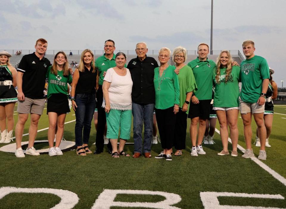 Bob Ledbetter’s family joins him before the game during a ceremony to name the field in his name at Dragon Stadium in Southlake, Texas, Friday Aug. 25, 2023. Southlake led Eastwood 42-14 at the half. (Special to the Star-Telegram Bob Booth)