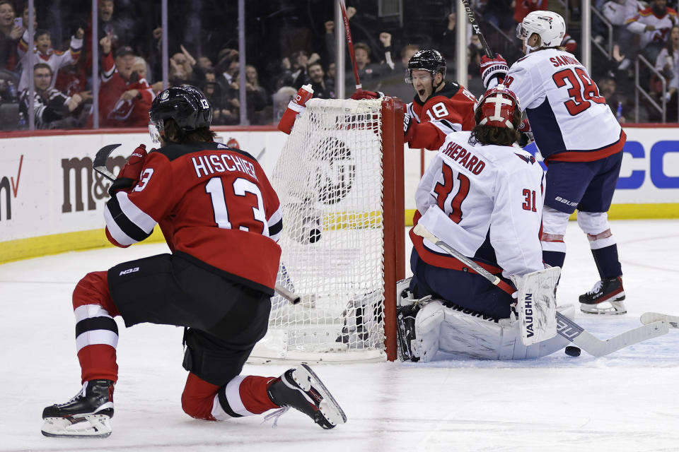 New Jersey Devils center Nico Hischier celebrates his goal past Washington Capitals goaltender Hunter Shepard (31) during the second period of an NHL hockey game Wednesday, Oct. 25, 2023, in Newark, N.J. (AP Photo/Adam Hunger)