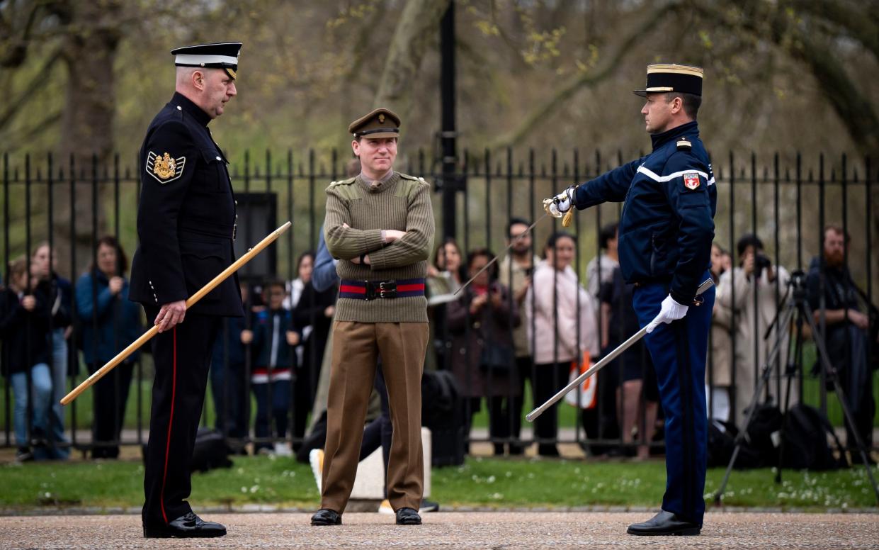 French and British military personnel at Wellington Barracks in London during rehearsals for the Changing the Guard ceremony on Monday