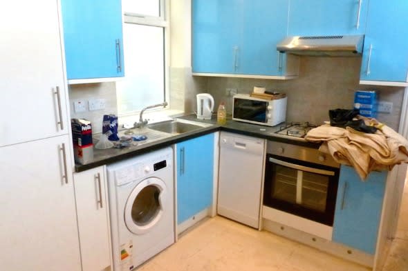 The kitchen of the converted toilet block