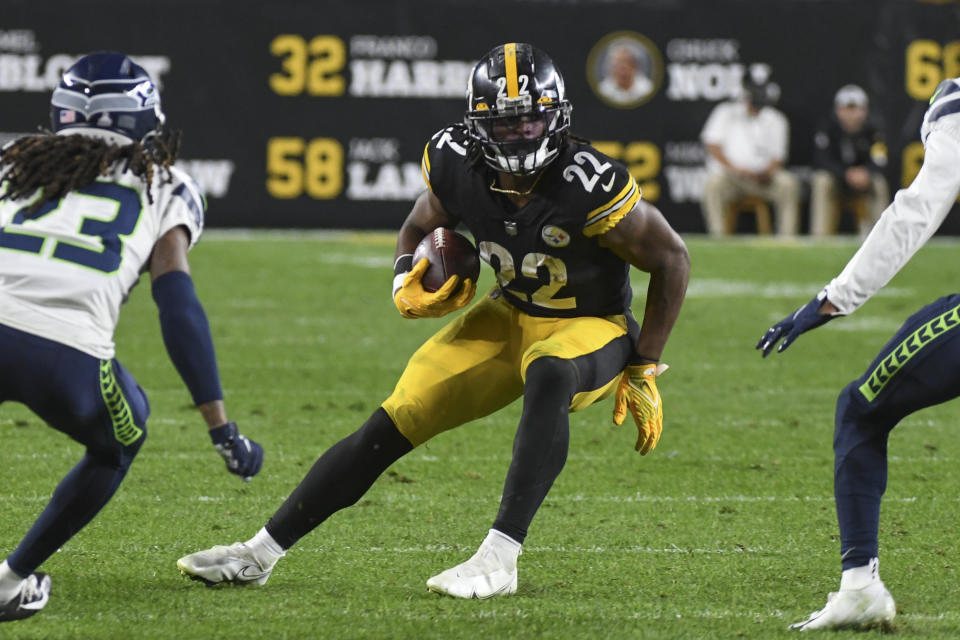 Pittsburgh Steelers running back Najee Harris (22) runs the ball away from Seattle Seahawks cornerback Sidney Jones (23) during the first half an NFL football game, Sunday, Oct. 17, 2021, in Pittsburgh. (AP Photo/Fred Vuich)