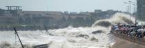 Spectators are swept by huge waves while watching tides of Qiantang River at a dike on August 31, 2011 in Haining, Zhejiang Province of China. 