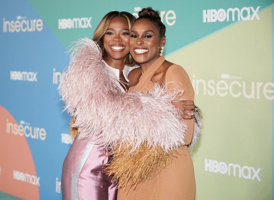 Two Black women hugging each other