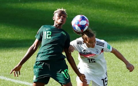 Uchenna Kanu in action with Germany's Giulia Gwinn - Credit: Reuters