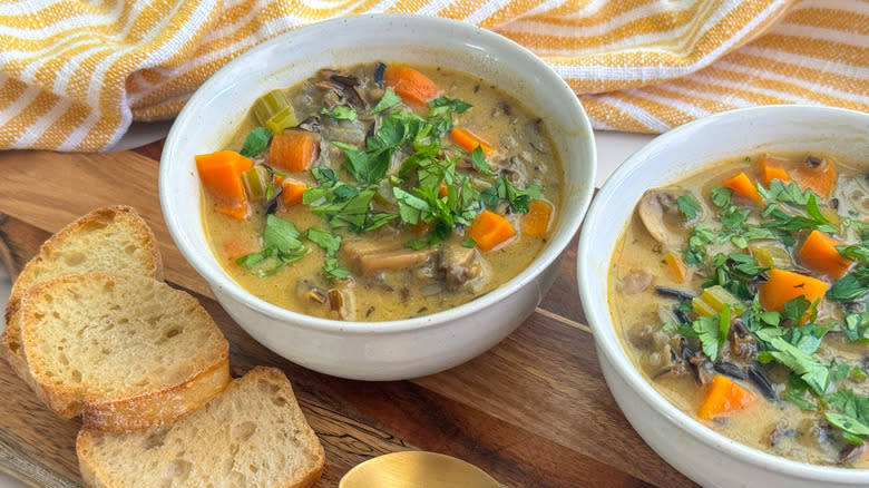 bowls of soup with bread