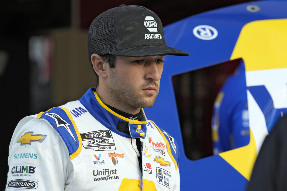 Chase Elliott watches as his crew works on his car during a practice for the NASCAR Daytona 500 auto race Friday, Feb. 17, 2023, at Daytona International Speedway in Daytona Beach, Fla. (AP Photo/Chris O'Meara)