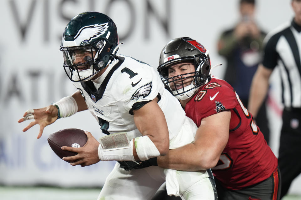 Philadelphia Eagles quarterback Jalen Hurts (1) is sacked for a safety in the end zone by Tampa Bay Buccaneers linebacker Anthony Nelson (98). (AP Photo/Chris O'Meara)