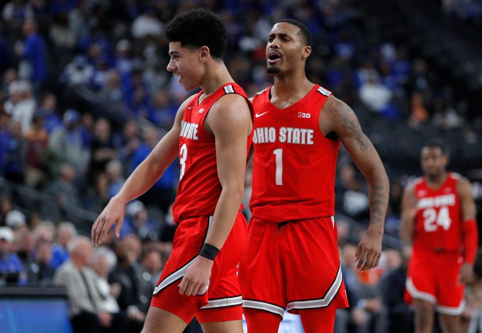 Ohio State's D.J. Carton, left, and Luther Muhammad celebrate as they lead against Kentucky during the second half of an NCAA college basketball game Saturday, Dec. 21, 2019, in Las Vegas. (AP Photo/John Locher)