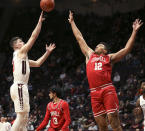 Virginia Tech's Hunter Cattoor (0) shoots over Cornell's Kobe Dickson (12) during the first half of an NCAA college basketball game Wednesday, Dec. 8 2021, in Blacksburg, Va. (Matt Gentry/The Roanoke Times via AP)