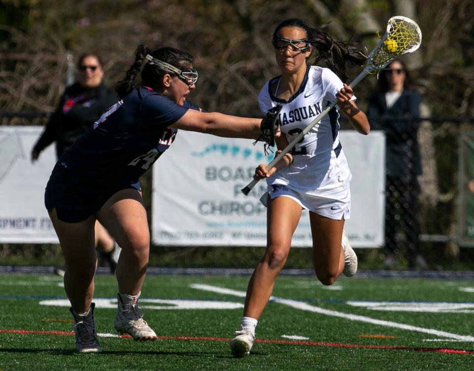 Manasquan's #2 Talia Blum gets checked by Wall's Melania Infozino #24. Wall vs Manasquan lacrosse.  
Manasquan, NJ
Friday, April 29, 2022