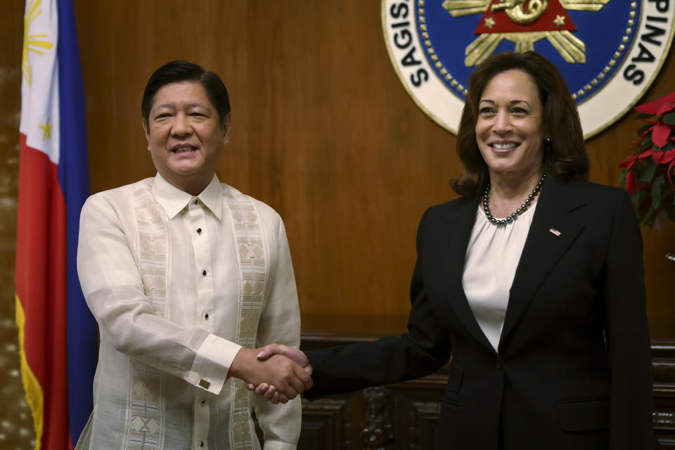 U.S. Vice President Kamala Harris, right, shakes hands with Philippine President Ferdinand Marcos Jr. at the Malacanang presidential palace in Manila, Philippines Monday, Nov. 21, 2022 (Eloisa Lopez/Pool Photo via AP)