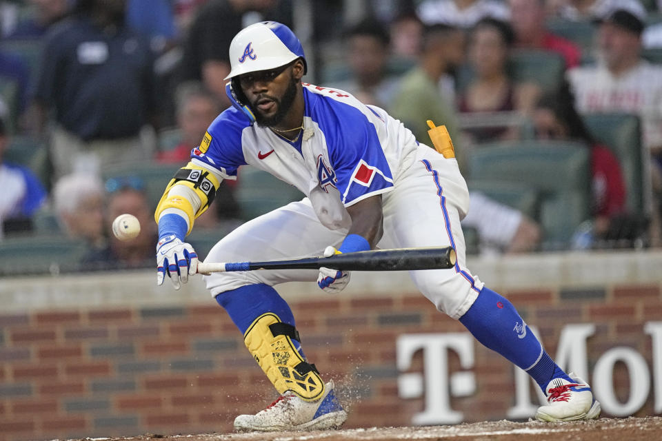 Atlanta Braves' Michael Harris II hits a sacrifice bunt during the fourth inning of the team's baseball game against the Milwaukee Brewers on Saturday, July 29, 2023, in Atlanta. (AP Photo/John Bazemore)