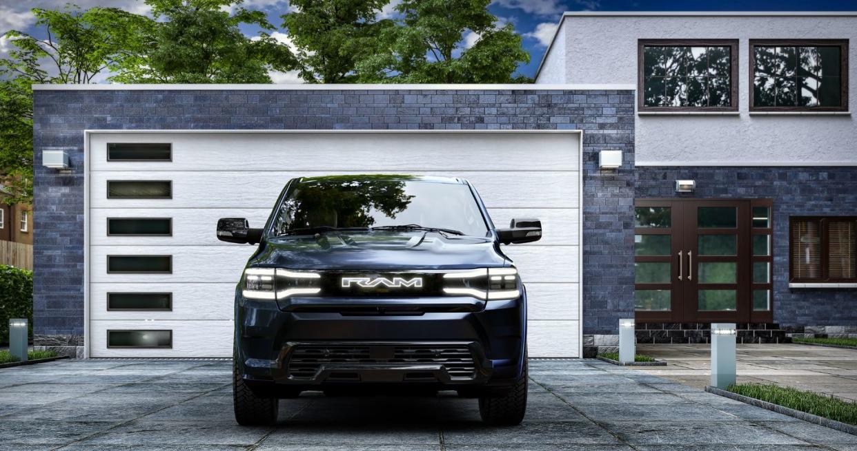 2025 ram 1500 rev front view parked in front of home in driveway