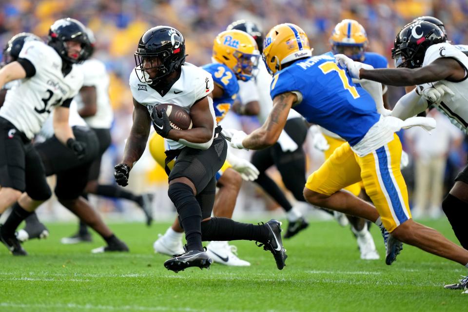 Cincinnati Bearcats running back Corey Kiner (21) carries the ball in the first quarter of a college football game between the Cincinnati Bearcats at the Pittsburgh Panthers, Saturday, Sept. 9, 2023, at Acrisure Stadium in Pittsburgh, Pa.