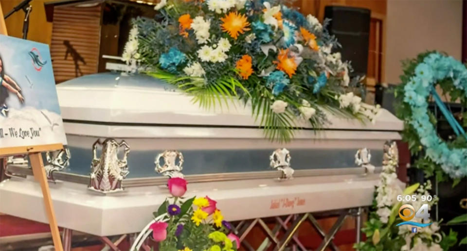 An image of a casket, with flowers taken at Jakiel Allyson Jones' funeral.