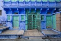 <p>Electrifying greens and purples make a statement on an intricately detailed building in India.</p>