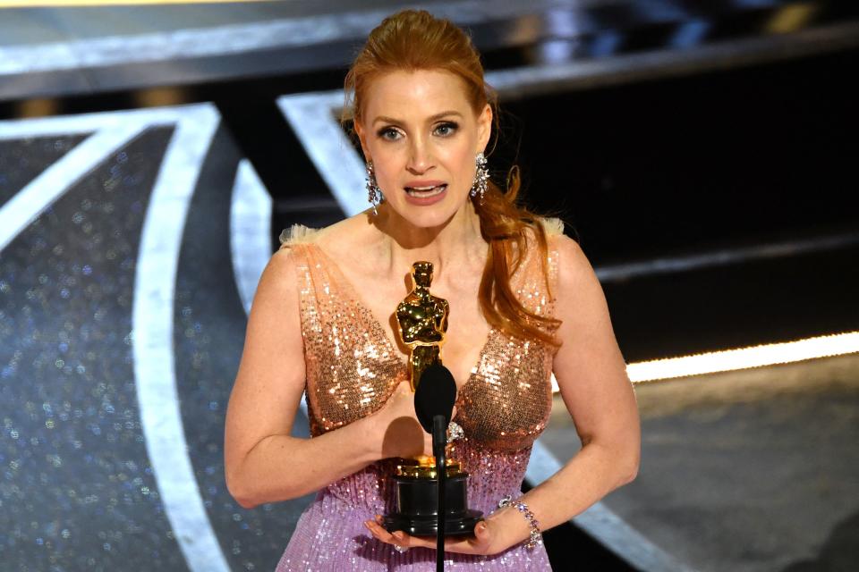 US actress Jessica Chastain accepts the award for Best Actress in a Leading Role for her performance in 