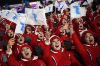 <p>Members of the North Korean cheering band wave flags ahead of the opening ceremony of the Pyeongchang 2018 Winter Olympic Games at the Pyeongchang Stadium on February 9, 2018. </p>