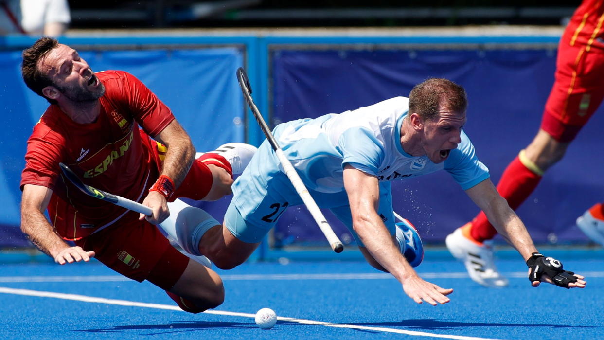 Tokyo 2020 Olympics - Hockey - Men's Pool A - Argentina v Spain - Oi Hockey Stadium, Tokyo, Japan - July 24, 2021. Lucas Rossi of Argentina in action with David Alegre of Spain. REUTERS/Phil Noble