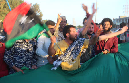 Libyans celebrate as forces are close to securing last Islamic State holdouts in Sirte, Libya December 5, 2016. Picture taken December 5, 2016. REUTERS/Ayman Sahely