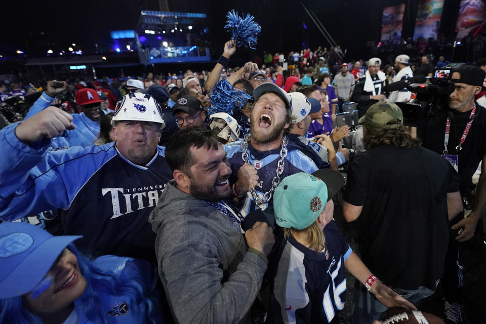 Tennessee Titans fans cheer during the third round of the NFL football draft, Friday, April 28, 2023, in Kansas City, Mo. (AP Photo/Charlie Riedel)