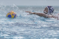 U.S. Olympic Water Polo Team attacker Max Irving trains for the Paris Olympics, at Mt. San Antonio College in Walnut, Calif., on Wednesday, Jan. 17, 2024. Irving's father, Michael Irving, is a Pac-12 college basketball referee. Max Irving is also the only Black man on the U.S. Olympic Water Polo Team and a prominent advocate for diversity in the sport. (AP Photo/Damian Dovarganes)