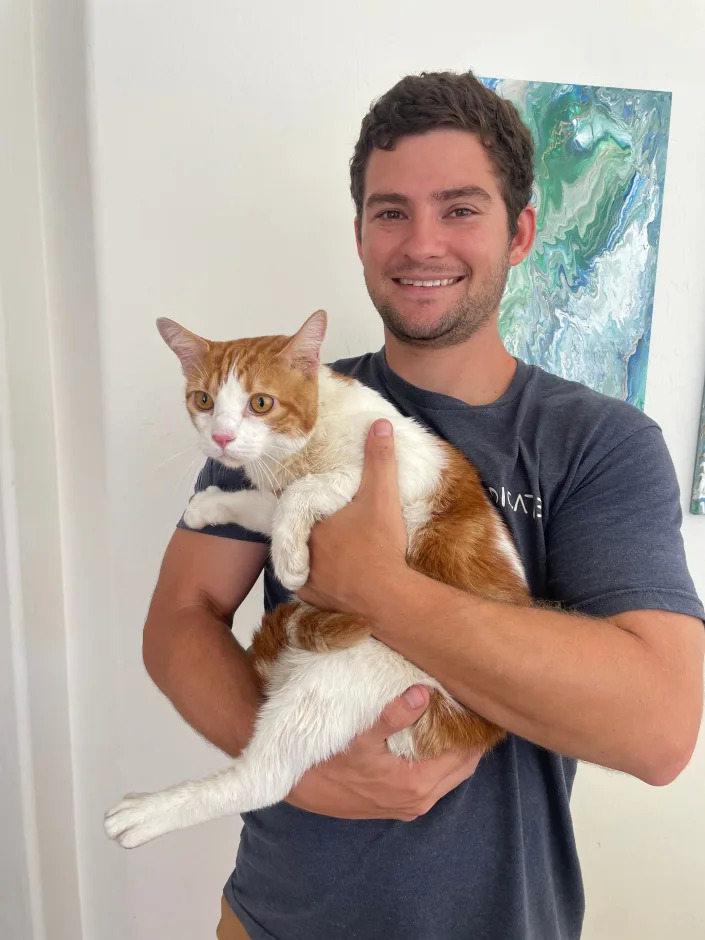 Michael Ross, 29, of Naples, Florida, was in Bonita Springs at his parents' place when Hurricane Ian plowed through, leading him to save a cat from drowning at a nearby flooding home.