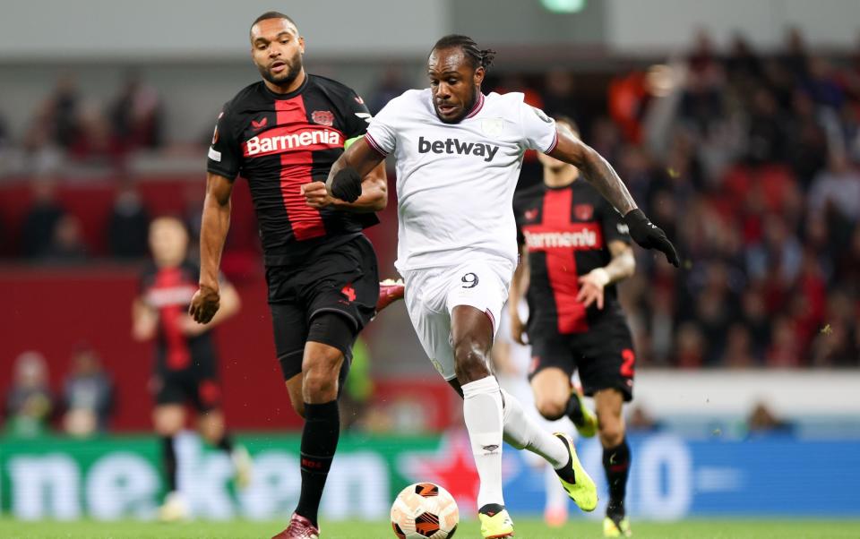 Michail Antonio surges away from Jonathan Tah