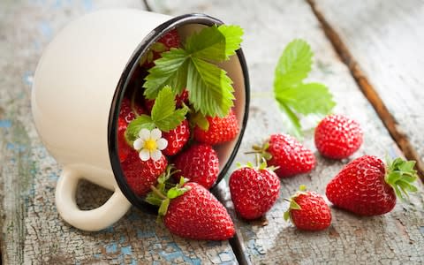 Mug with strawberries - Credit: Alamy