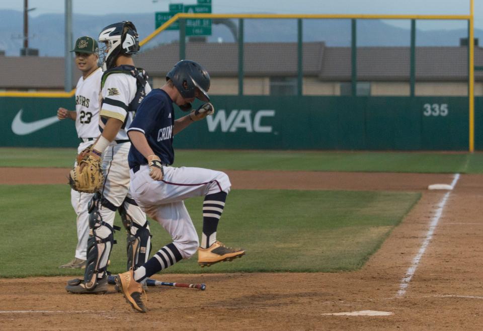 Trey Evans stomps on home after hitting a clutch three-run home run against Snow Canyon on Friday