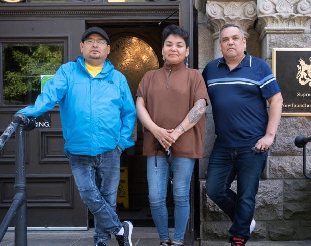 Grand Chief Etienne Rich, Deputy Grand Chief Mary Ann Nui and Chief Eugene Hart stand outside of Newfoundland and Labrador Supreme Court in St. John's last month. (Submitted by Greg Locke - image credit)