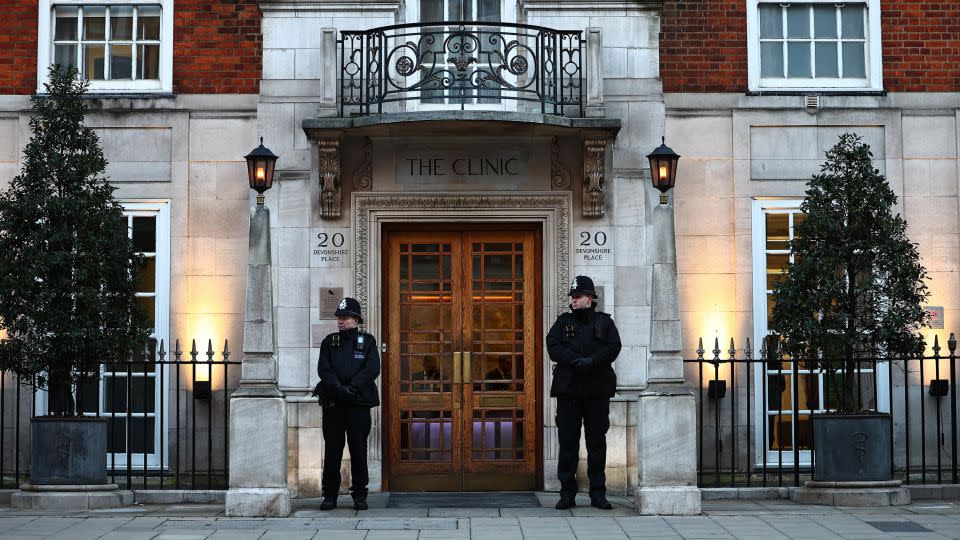 Police officers stand guard outside the London Clinic on January 18, days after the Princess of Wales underwent surgery. - Henry Nicholls/AFP/Getty Images
